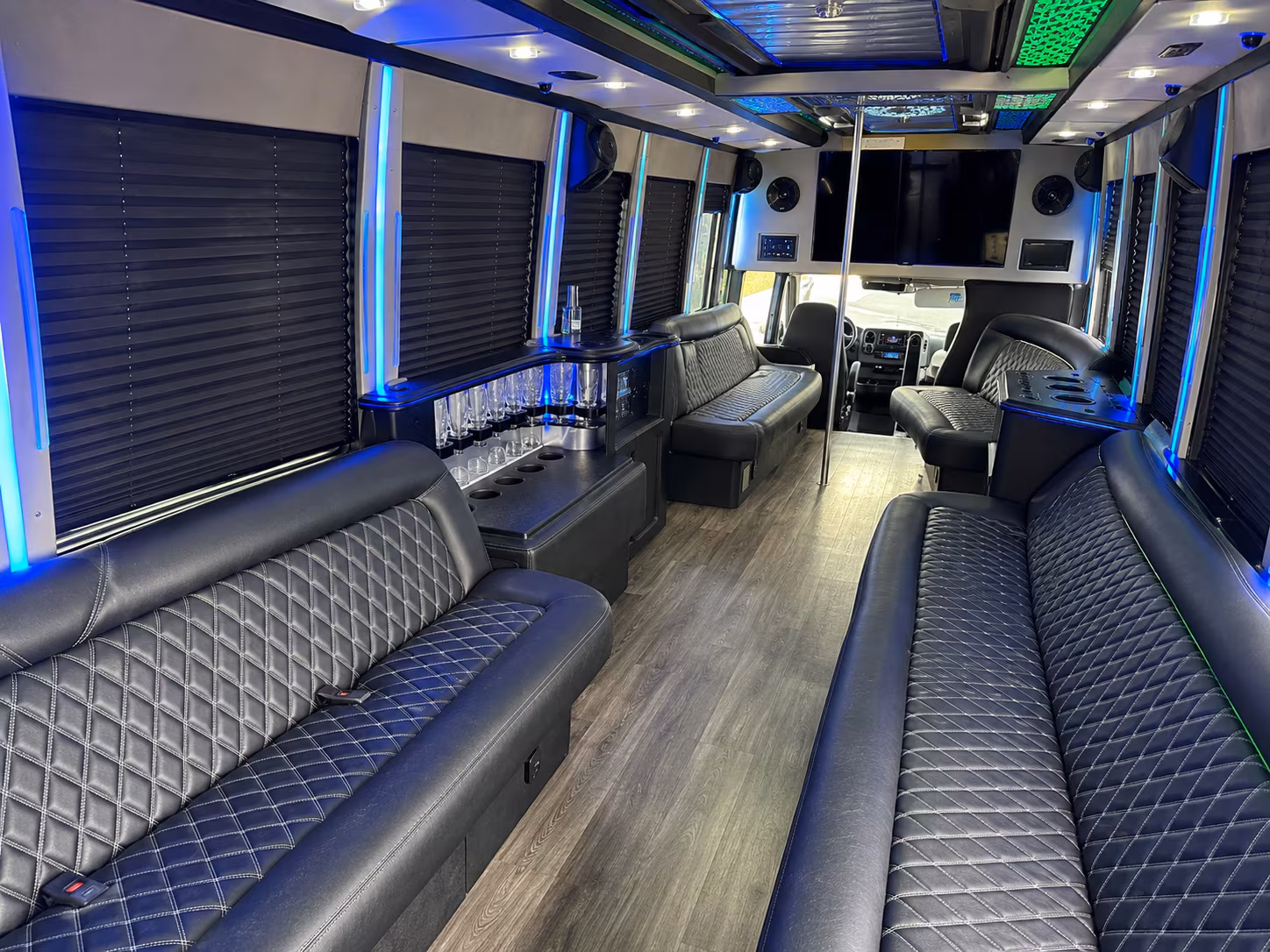 Friends laughing during a party bus celebration in Murfreesboro